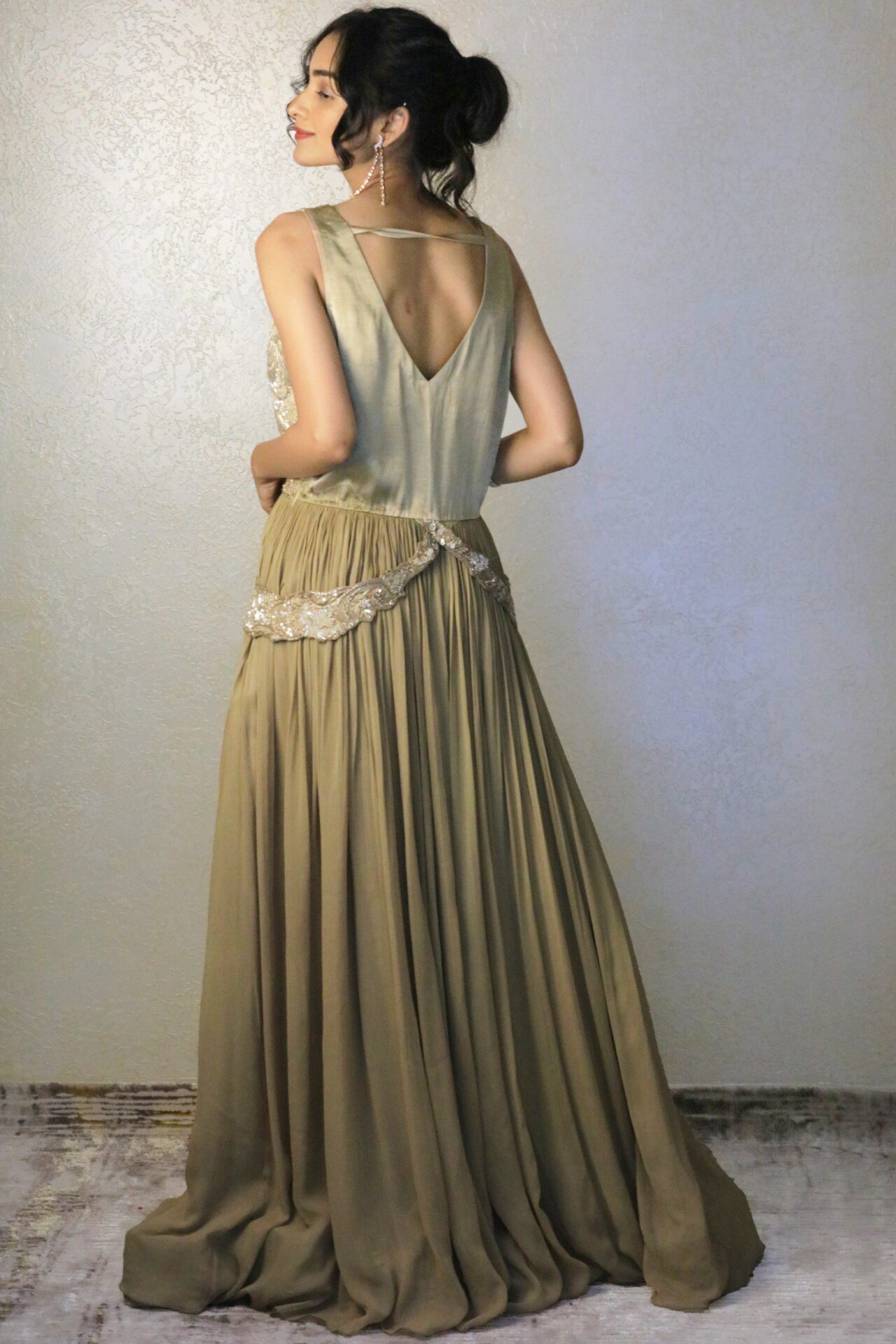 Beige cocktail gown with fully embroidered yoke.