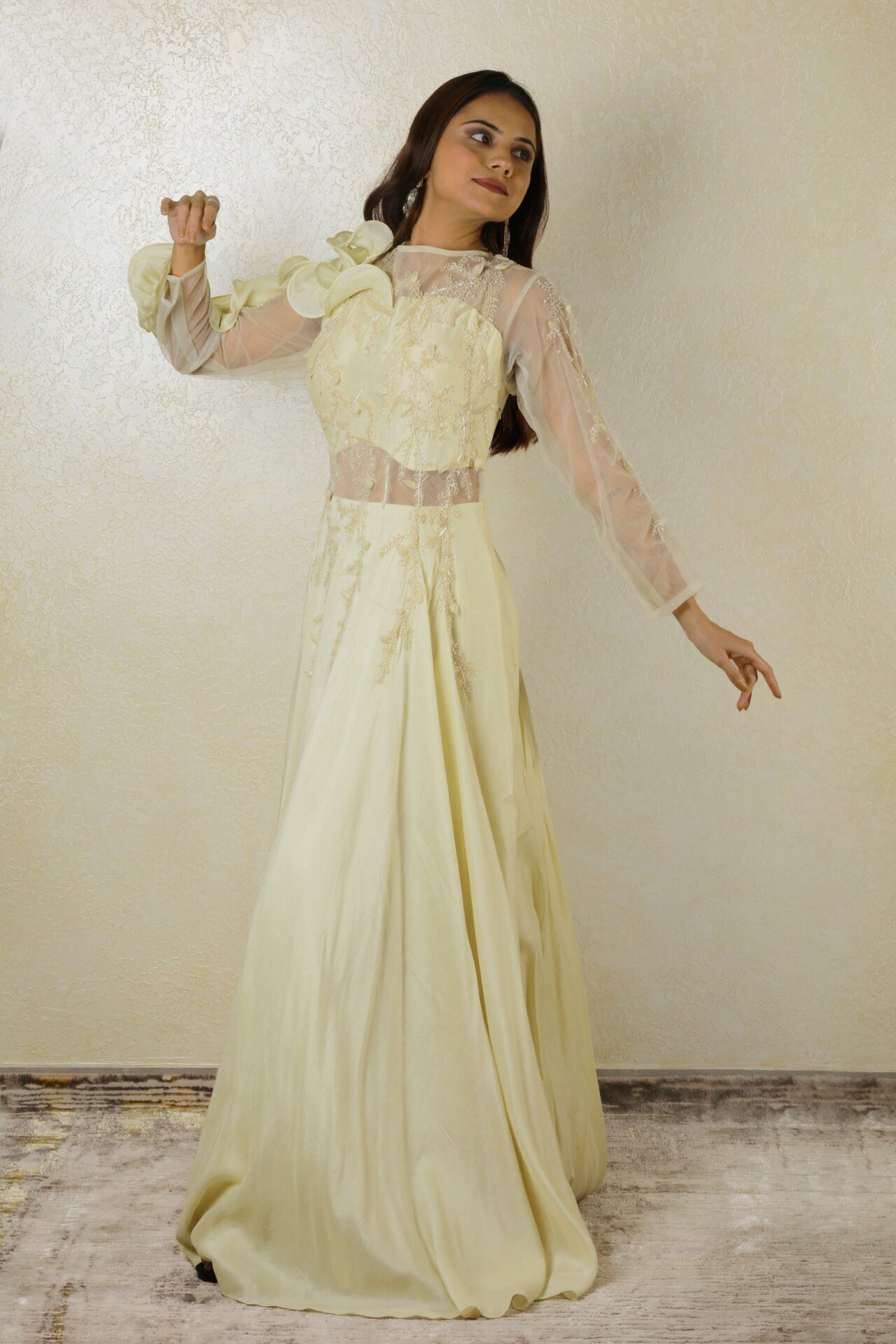 Ivory gown with ruffle design