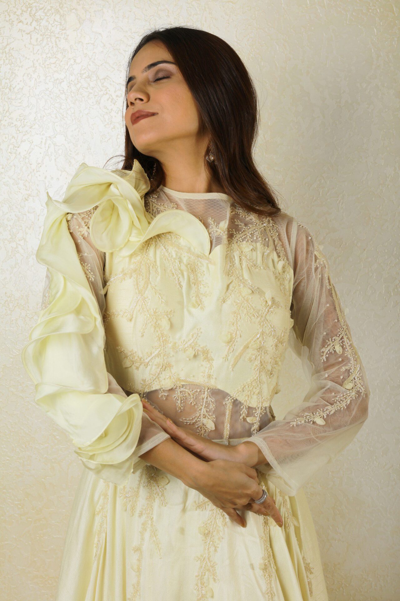 Ivory gown with ruffle design