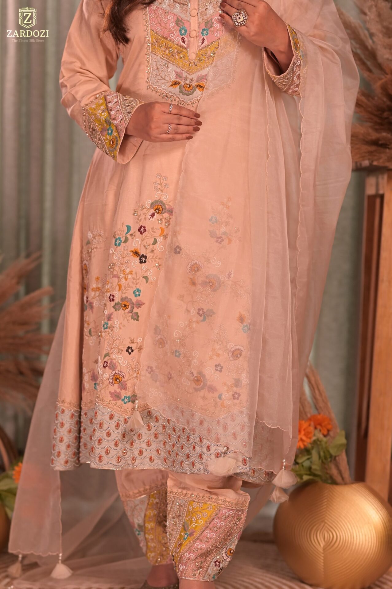 A peach kurta set with pants.