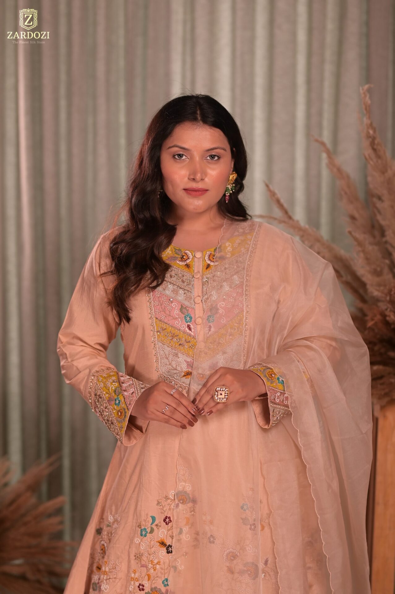 A peach kurta set with pants.