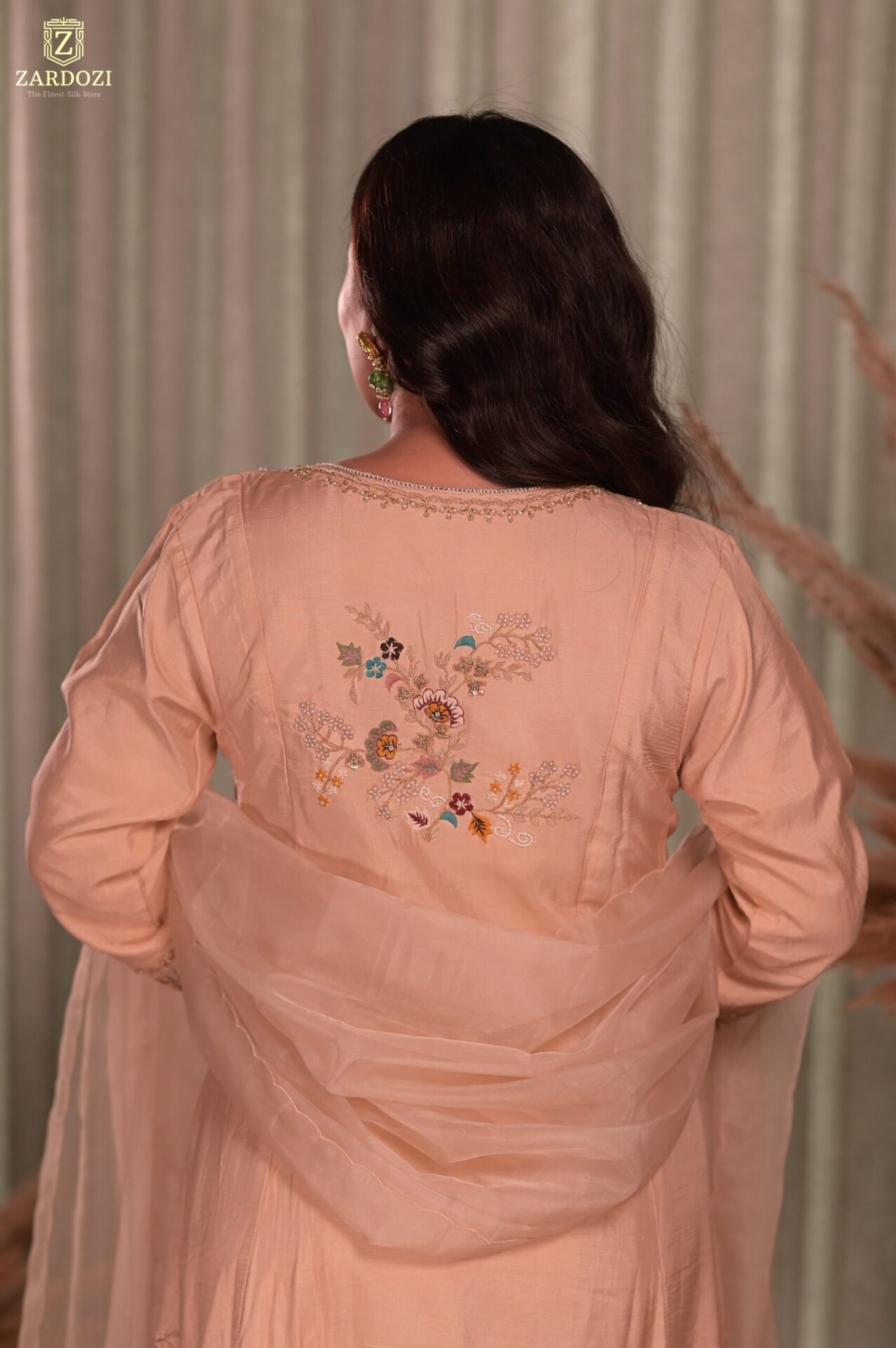 A peach kurta set with pants.