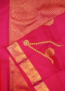 Kanjivaram saree in pink colour. Zari butta, zari border and zari pallu.