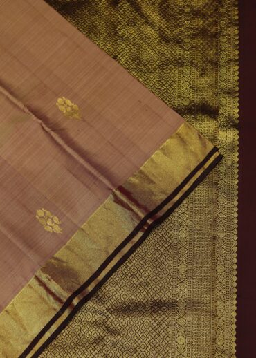 Peach pink kanjeevaram saree with zari border and butis, contrast wine blouse